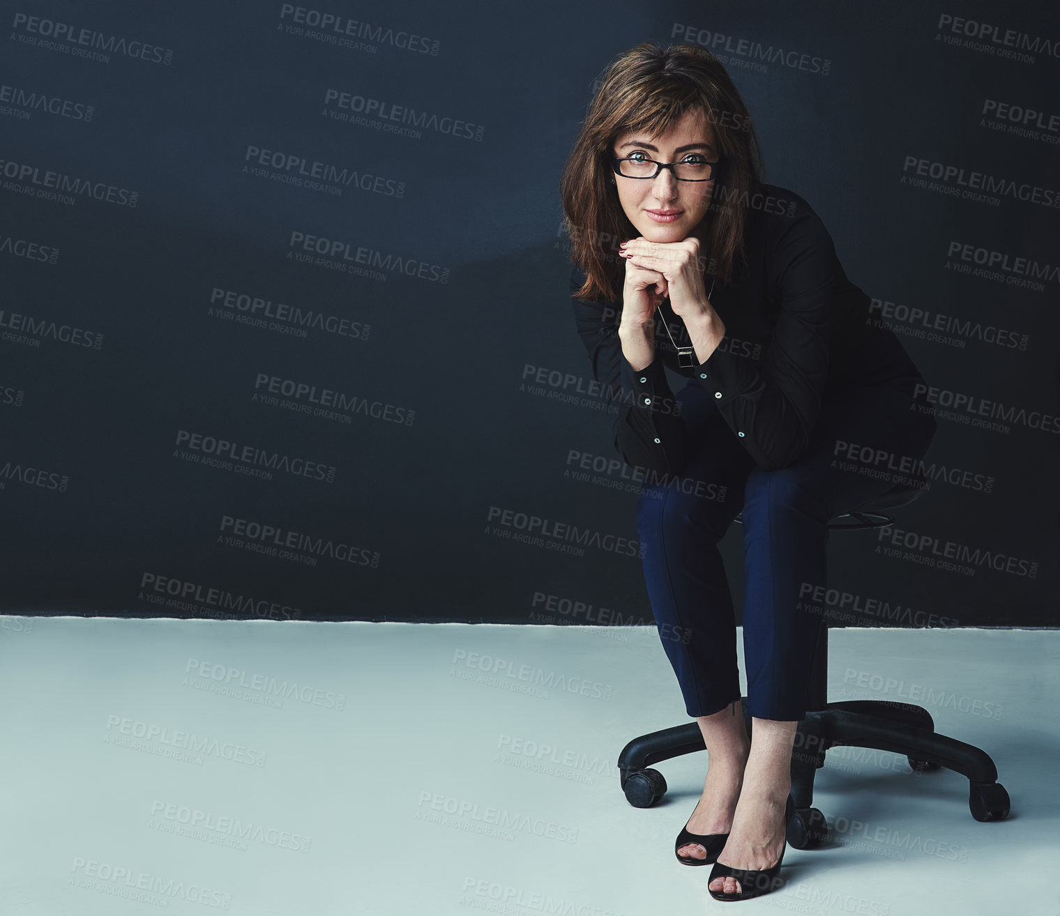 Buy stock photo Portrait, confidence and business woman on chair in studio, compliance officer and policy advisor. Glasses, entrepreneur and female person, worker or regulatory agent on dark background mockup space