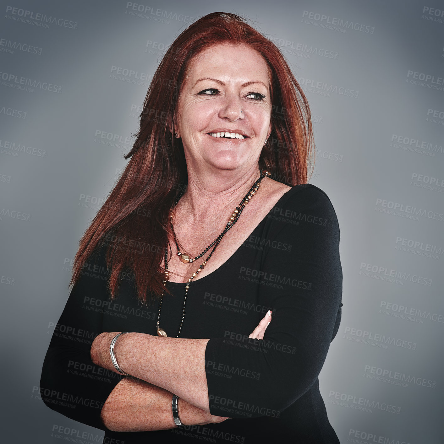 Buy stock photo Studio shot of a businesswoman posing against a grey background