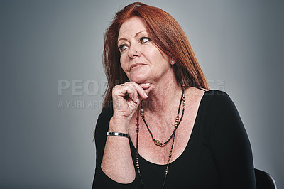 Buy stock photo Studio shot of a businesswoman posing against a grey background