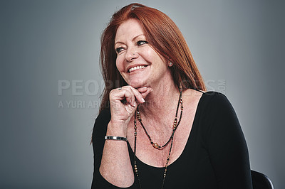 Buy stock photo Studio shot of a businesswoman posing against a grey background