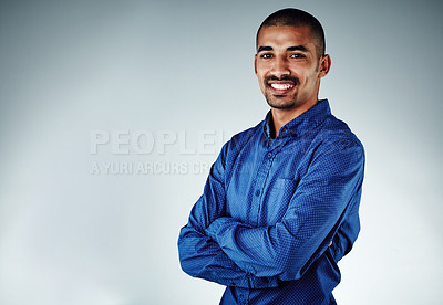 Buy stock photo Cropped shot of a young businessman posing against a grey background