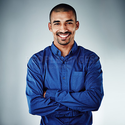 Buy stock photo Cropped shot of a young businessman posing against a grey background