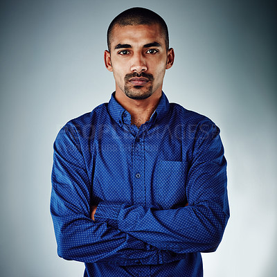 Buy stock photo Cropped shot of a young businessman posing against a grey background