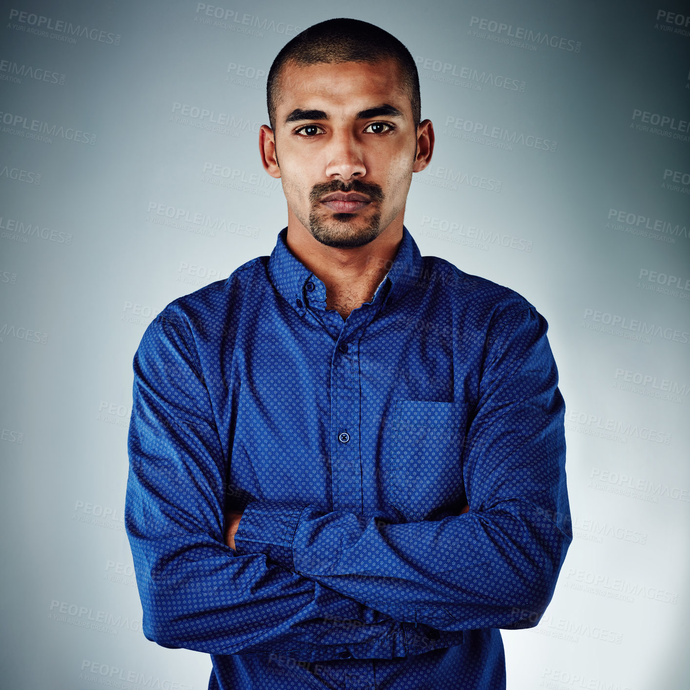 Buy stock photo Cropped shot of a young businessman posing against a grey background