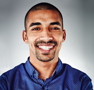 Buy stock photo Cropped shot of a young businessman posing against a grey background