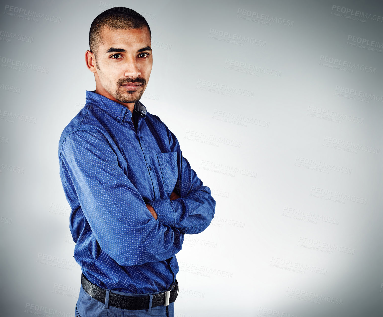 Buy stock photo Cropped shot of a young businessman posing against a grey background