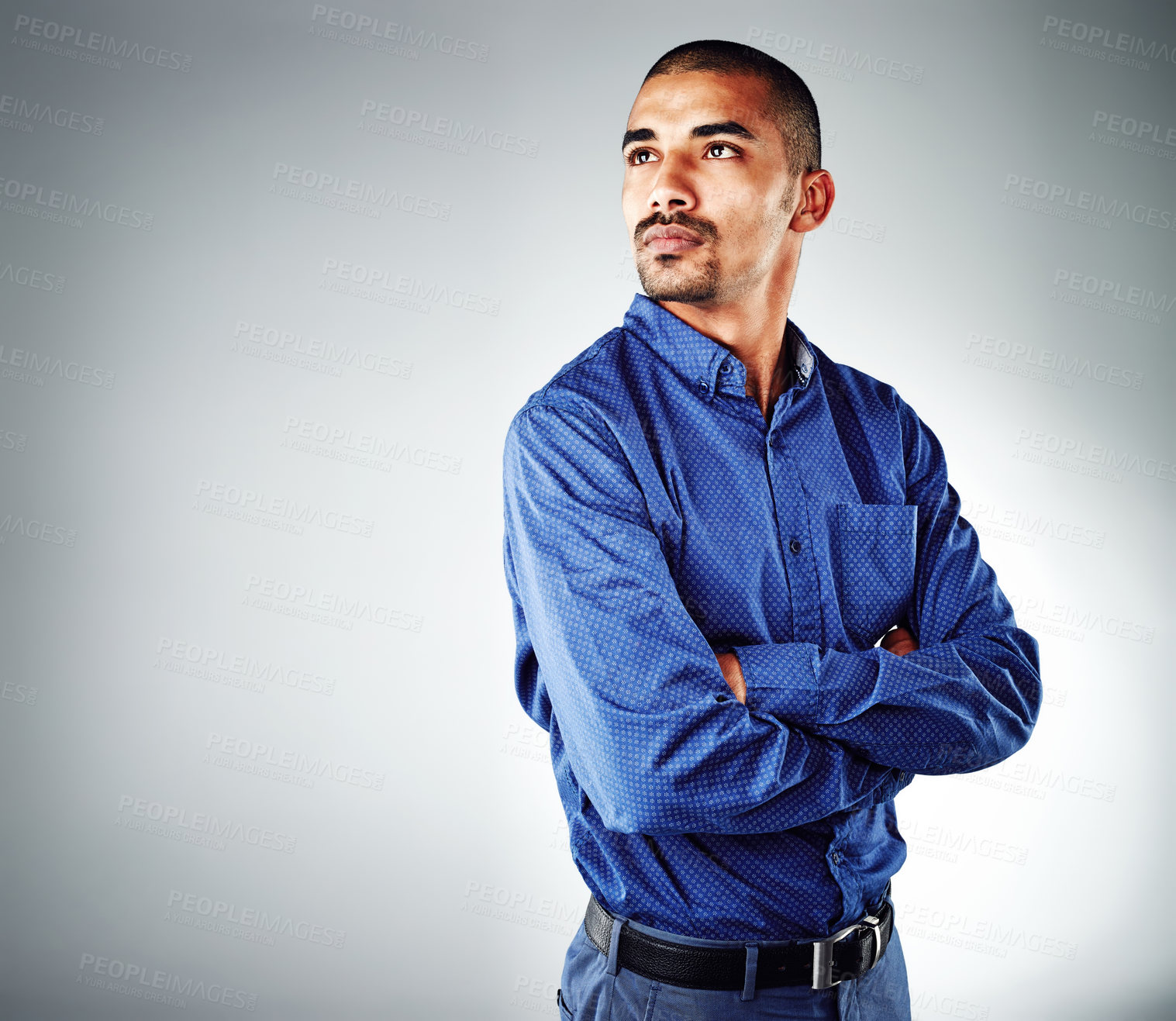 Buy stock photo Cropped shot of a young businessman posing against a grey background