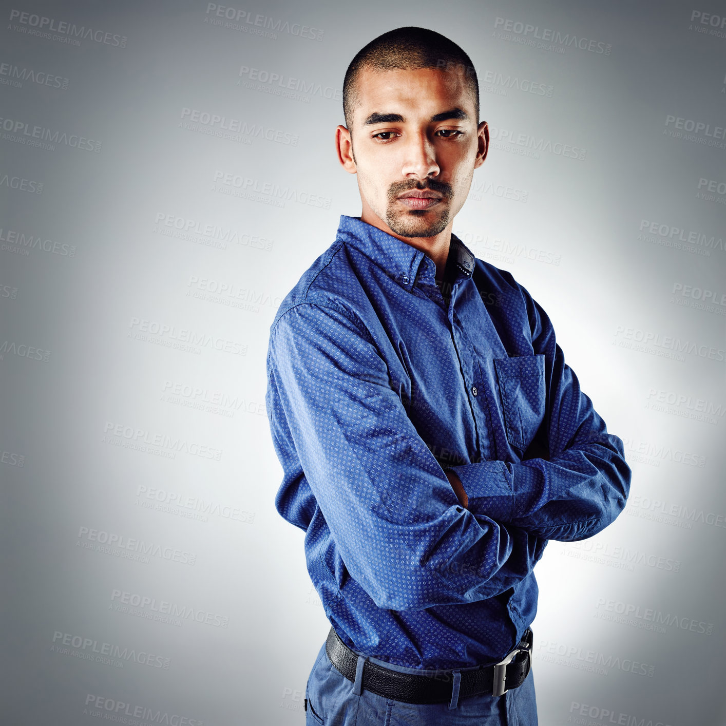 Buy stock photo Cropped shot of a young businessman posing against a grey background