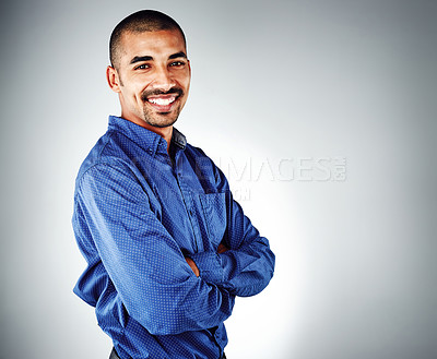 Buy stock photo Cropped shot of a young businessman posing against a grey background