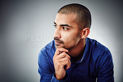 Buy stock photo Cropped shot of a young businessman posing against a grey background