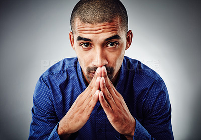 Buy stock photo Cropped shot of a young businessman posing against a grey background