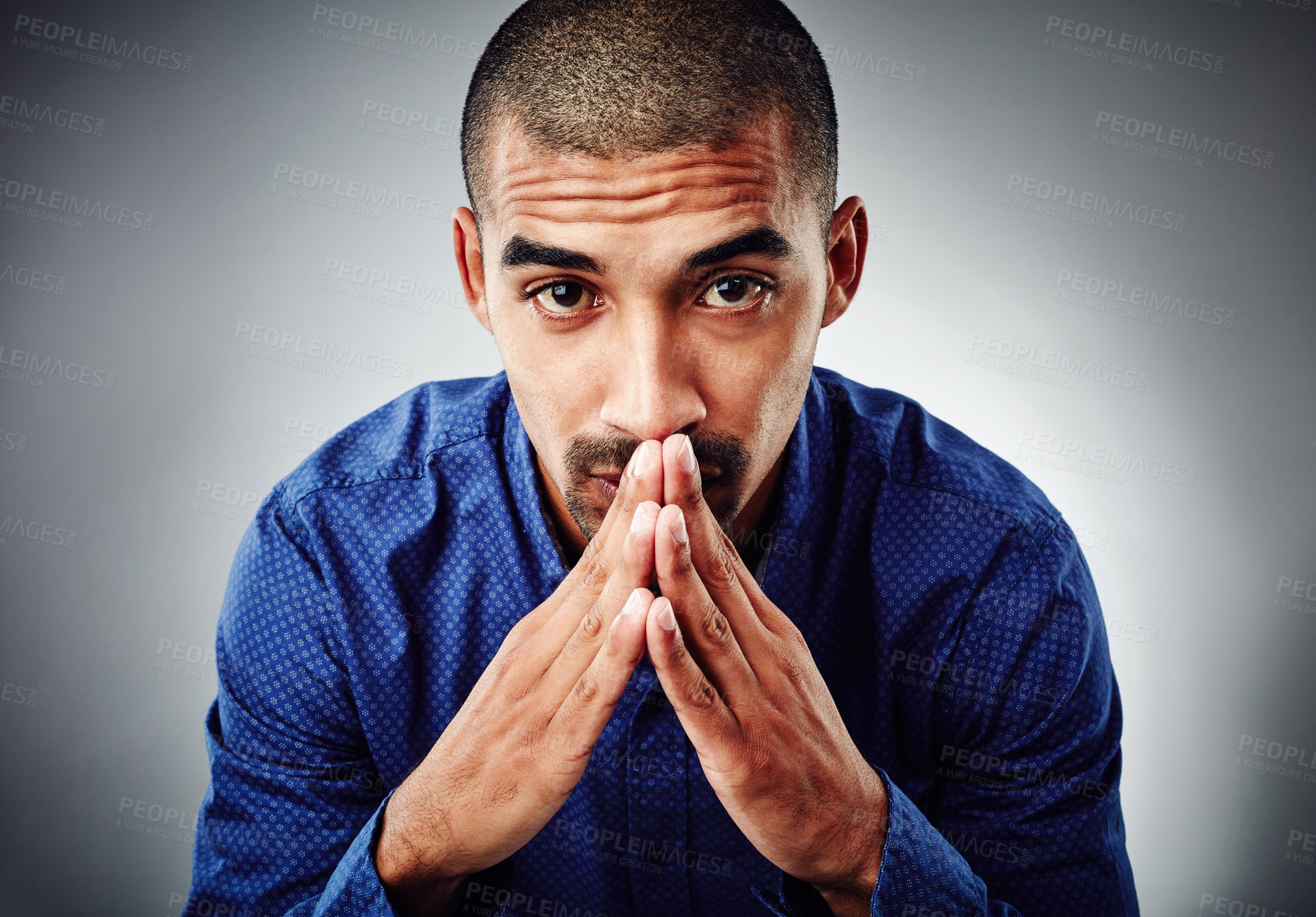 Buy stock photo Cropped shot of a young businessman posing against a grey background