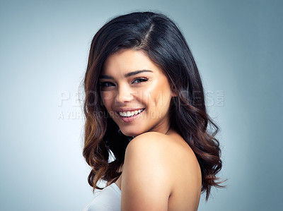 Buy stock photo Happy girl, hair and portrait in studio for wellness, cosmetics or shampoo shine results on grey background. Glow, beauty and face of woman model with haircare pride, volume or balayage satisfaction