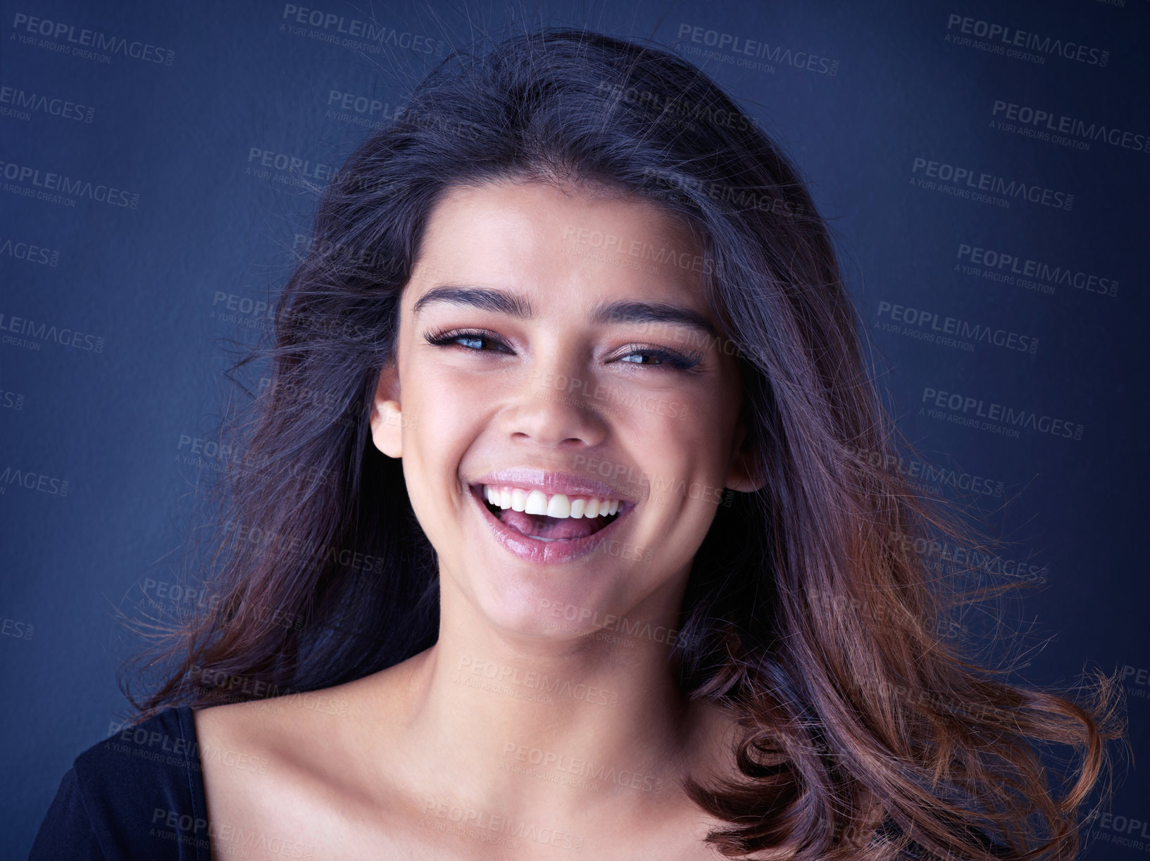 Buy stock photo Hair, portrait or happy woman in studio for beauty, shine or shampoo cosmetics, treatment or results on blue background. Makeup, haircare or face of gen z model smile for glow, pride or wellness