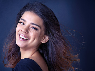 Buy stock photo Hair, portrait or happy Indian girl in studio for beauty, shine or shampoo cosmetics, treatment or results on blue background. Makeup, haircare or face of gen z model with smile, makeover or pride