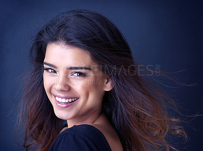 Buy stock photo Hair, portrait or happy gen z girl in studio for beauty, shine or shampoo cosmetics, treatment or results on blue background. Makeup, haircare or face of Indian model with glamour, makeover or pride