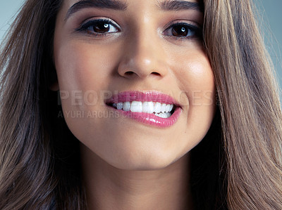 Buy stock photo Beauty, makeup and portrait of woman biting lip in studio for aesthetic wellness or flirting. Cosmetics, face and skincare with teeth of shy model at salon for dermatology treatment or lipstick