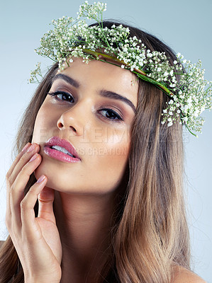 Buy stock photo Studio shot of a beautiful young woman wearing a floral head wreath