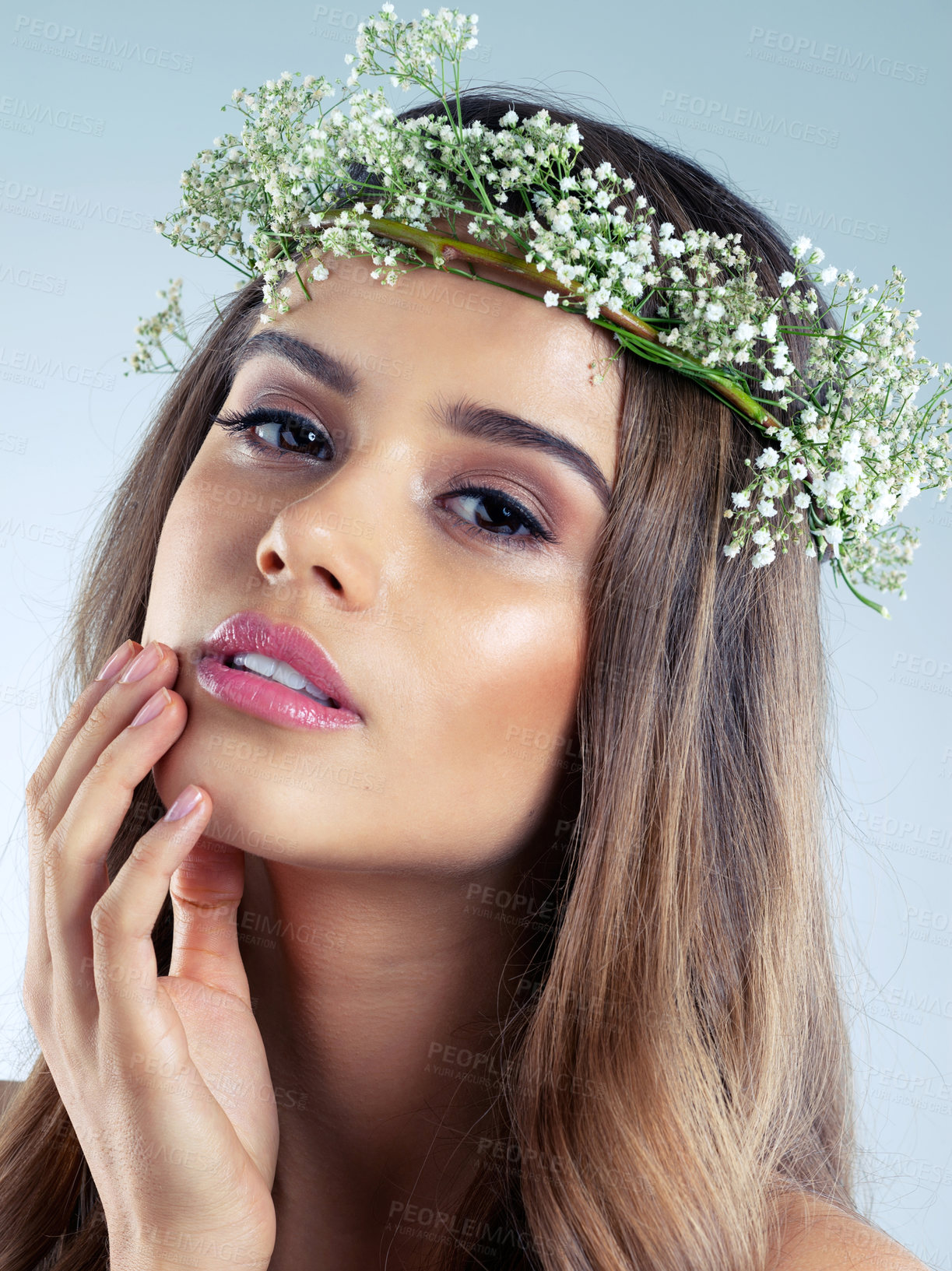 Buy stock photo Studio shot of a beautiful young woman wearing a floral head wreath