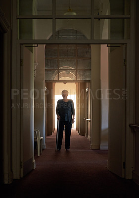 Buy stock photo Smile, walking stick and portrait of old woman in home of living room in retirement in dark hallway. Fashion, senior and happy elderly female person with disability for confidence on cane to relax