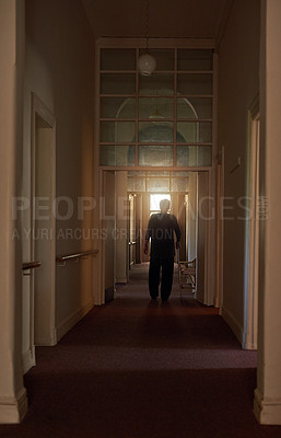 Buy stock photo Back, stick and old woman in home walking in living room in retirement in dark hallway or house. Healthy, senior lady and elderly female person with disability, calm peace or cane to relax or balance