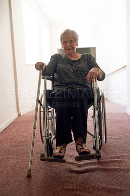 Buy stock photo Portrait, wheelchair and senior woman in corridor with disability, retirement and smile in nursing home. Elderly person, walking stick or accessories in hallway for memories, physical therapy or care