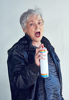 Buy stock photo Senior woman, graffiti or portrait with spray paint at wall for vandalism, painter or art for fun. Elderly person, street artist or public opinion with energy, excited or creative rebel in retirement