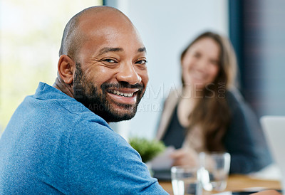 Buy stock photo Portrait of a young male designer sitting in the boardroom during a meeting