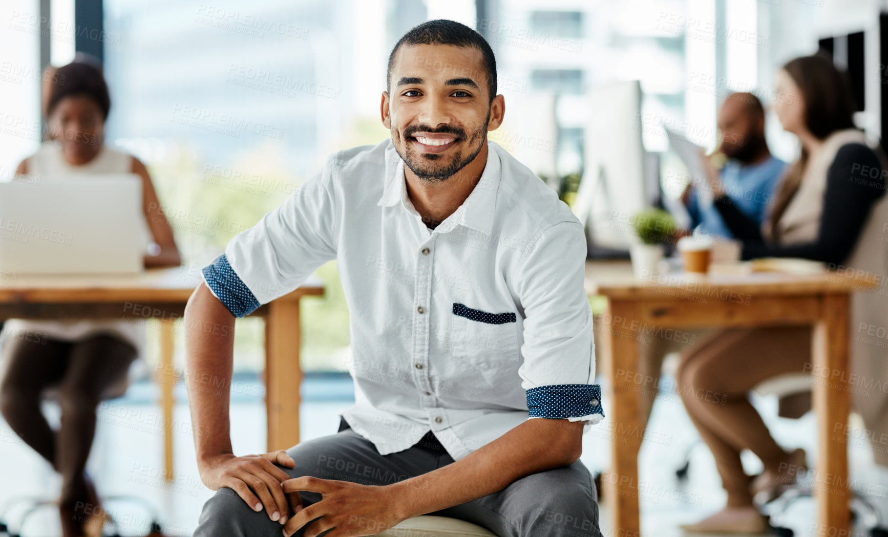 Buy stock photo Cropped portrait of a handsome young male designer sitting in the office