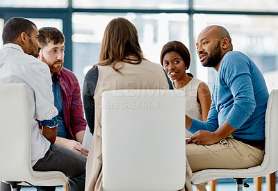 Buy stock photo Cropped shot of a group of young designers sitting in a meeting in their office