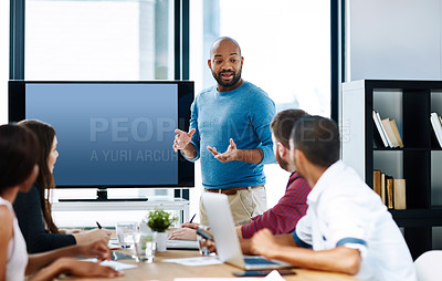 Buy stock photo Cropped shot of a young male designer giving a presentation in the boardroom