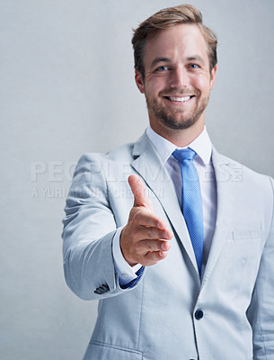 Buy stock photo Studio shot of a businessman in a grey suit posing against a grey background