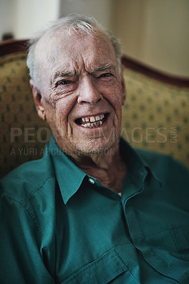 Buy stock photo Senior man, portrait and laughing on sofa for retirement, comedy and wellness on couch. Elderly male person, happy and humour in nursing home for joke, memory and smile in living room or apartment