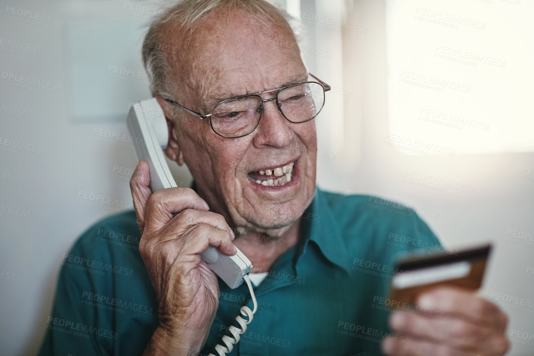 Buy stock photo Senior man, telephone and yelling with credit card on call for banking, finance or issues on account at home. Elderly male person talking with debit in financial problem, retirement or pension fund