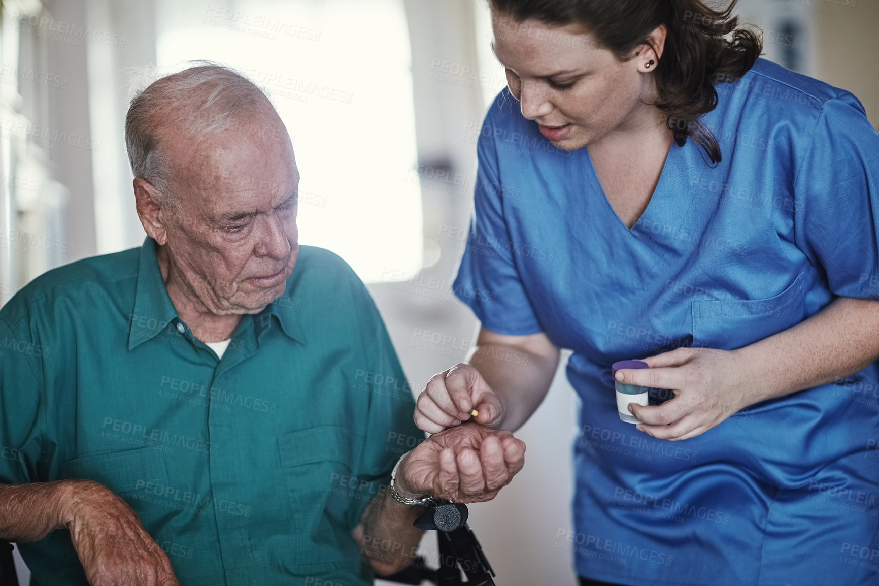 Buy stock photo Shot of a female nurse assisting her senior patient