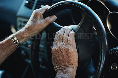Buy stock photo Closeup of a senior man's hands on the steering wheel of his car