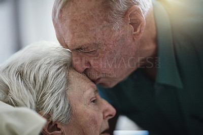 Buy stock photo Shot of a senior man visiting his wife in hospital