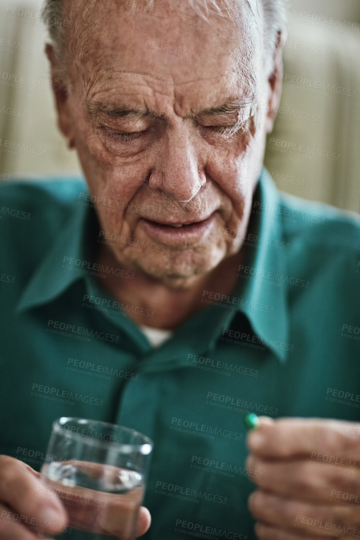 Buy stock photo Cropped shot of a senior man about to take his medication