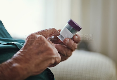 Buy stock photo Cropped shot of a senior man about to take his medication