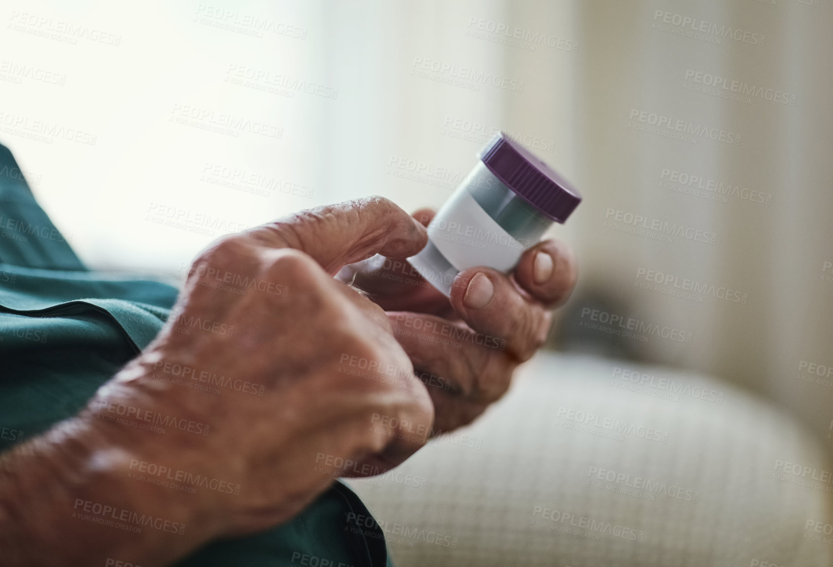 Buy stock photo Cropped shot of a senior man about to take his medication