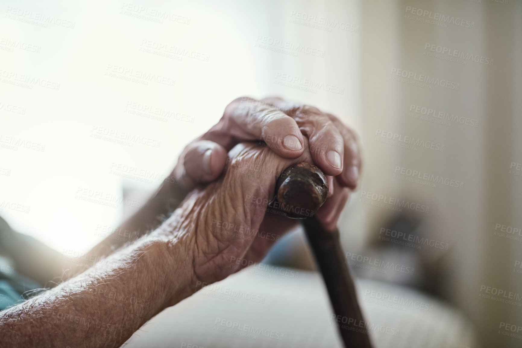 Buy stock photo Senior man, hands together and support with cane for old age, osteoporosis or care in retirement home. Closeup of elderly, pensioner or male person with a disability or walking stick for stability