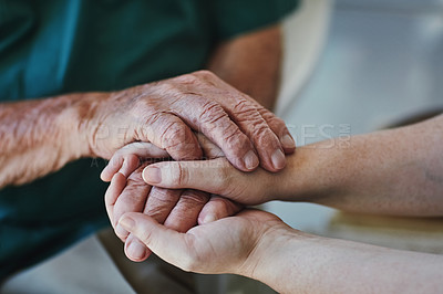 Buy stock photo Closeup shot of a woman holding a senior man's hands in comfort