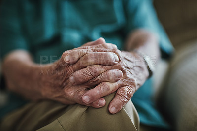 Buy stock photo Cropped shot of an unrecognizable senior male sitting indoors