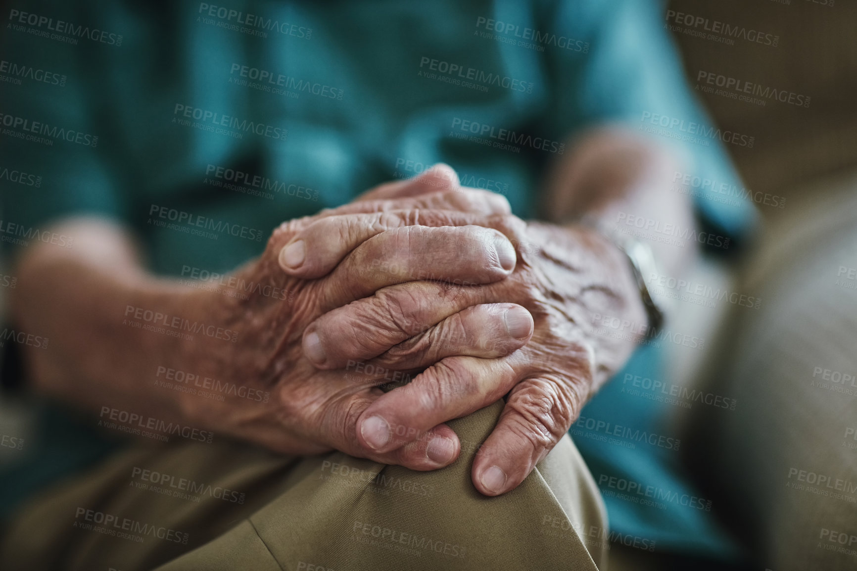 Buy stock photo Senior man, hands together and care with support for old age on sofa in retirement home. Closeup of elderly, retired pensioner or male person with pain, grief or loss in recovery or rehab at house