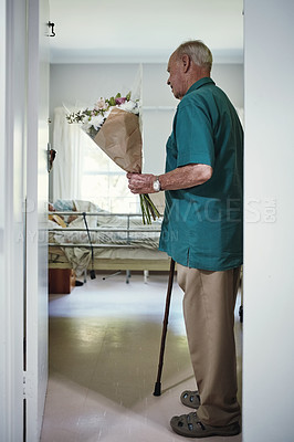 Buy stock photo Shot of a senior man arriving at the hospital with a  bunch of flowers