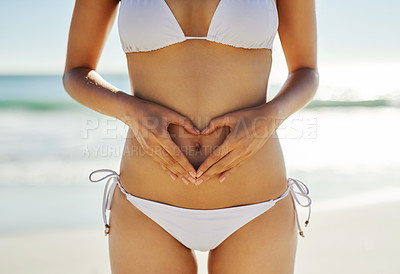 Buy stock photo Cropped shot of an unrecognizable woman posing in her bikini on the beach