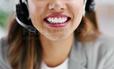 Buy stock photo Closeup shot of a young call centre agent working in an office