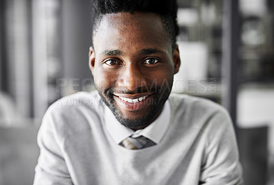 Buy stock photo Portrait of a smiling young businessman sitting at a desk in an office