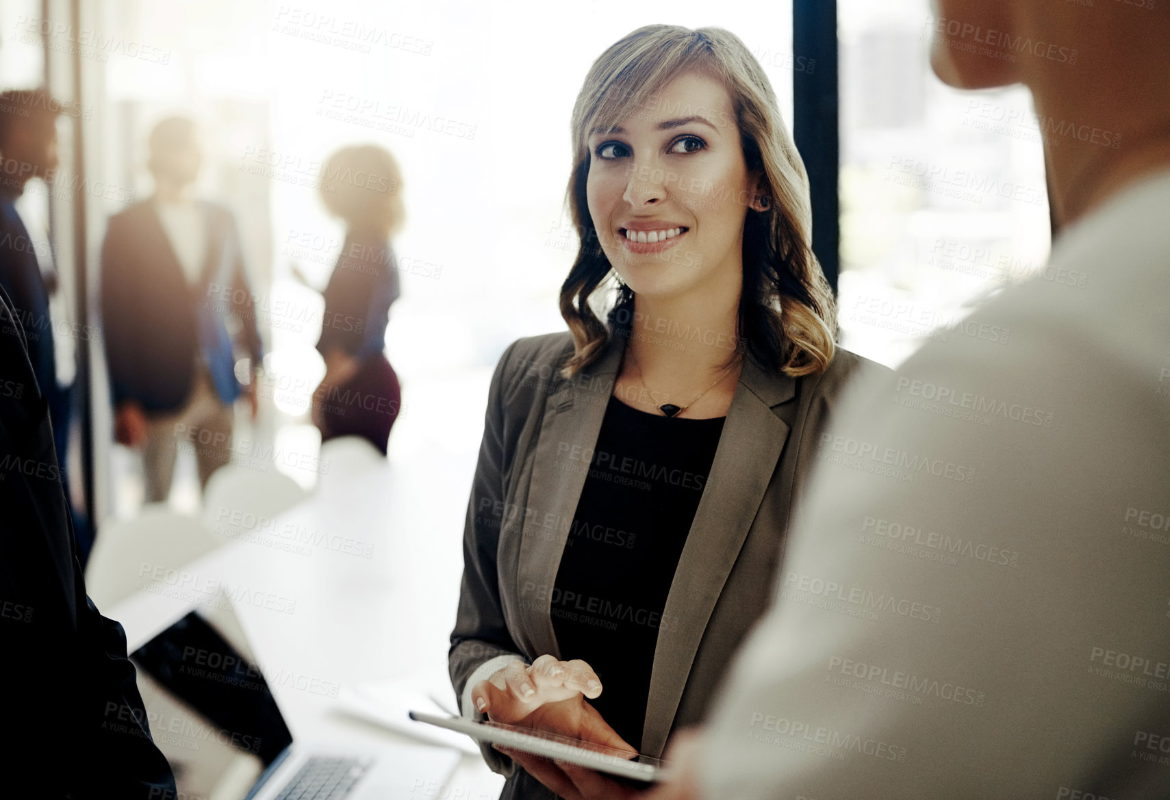 Buy stock photo Business people, tablet and conversation in company for discussion, teamwork and brainstorming. Woman, employee engagement and technology for collaboration, together or career as coworkers in meeting