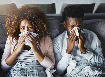 Buy stock photo Portrait of a sick couple suffering from the flu, corona or sinus at home together, feeling unwell and weak. Girlfriend and boyfriend in quarantine, recovering from a virus and resting indoors